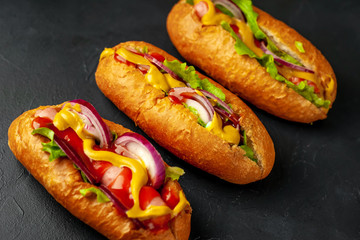 homemade hot dogs on concrete background, slate