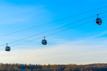 View of cableway gondola cable car on blue sky background