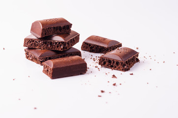 Slices of porous chocolate on a light background