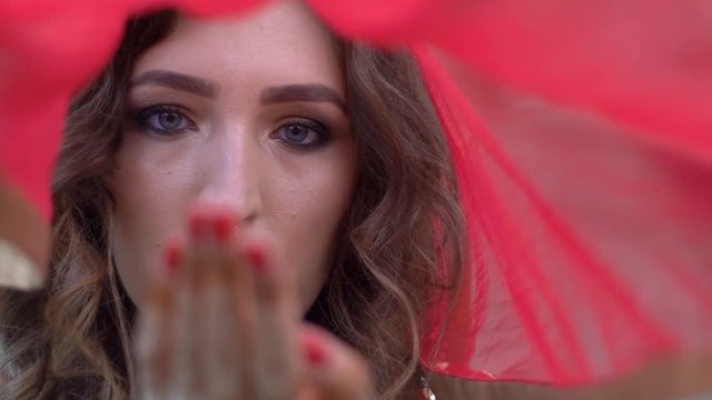 Beautiful Woman Touches Her Face With Hand