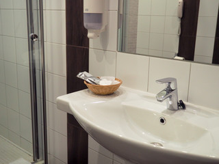 Bathroom interior with sink and faucet, sink with tap.