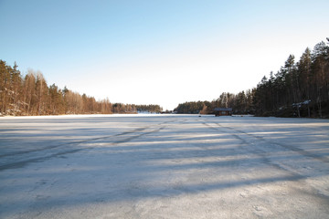 Frozen steppe river bay landscape, early spring, white snow and blue ice