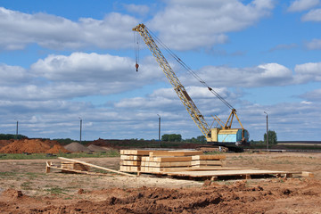 Large crawler crane at a Construction Site at Work. Construction equipment at the construction site.