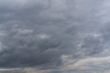 Dark sky covered with gray clouds.