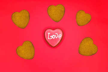 Heart-shaped biscuits for Valentine's Day. Gingerbread Valentine on wooden background