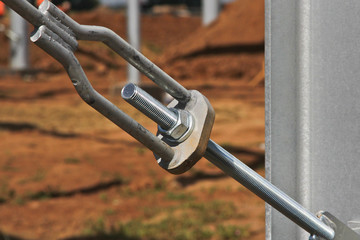 Hardware products and bolted connection closeup on the construction site.