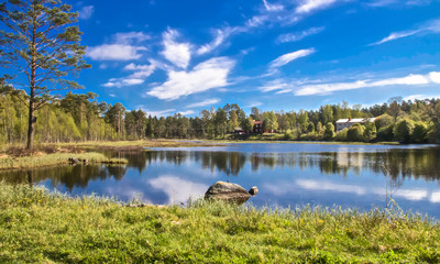 Fototapeta premium reflection of clouds in a swedish lake on a beautiful summer day