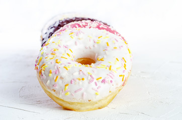multi-colored donuts on a white background