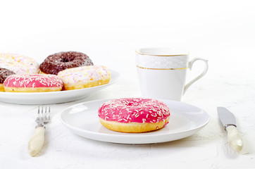 multi-colored donuts on a white background