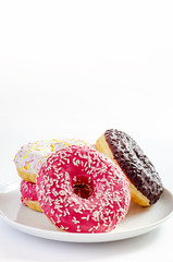 multi-colored donuts on a white background