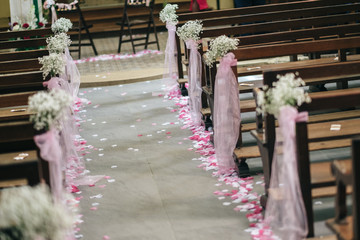 Church alley decorated with petals for weddings