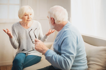Loving pensioners arguing about their new future garden