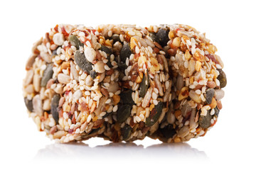 Delicious dessert of various seeds, nuts and dry fruits. Isolated on white background