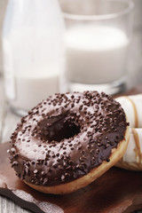 Chocolate donut with milk for breakfast