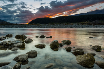 River stones at sunset, South Island, New Zealand,