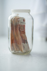 Russian money in glass jar
