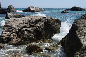 Fototapeta na wymiar Storm of the sea on the stone beach.