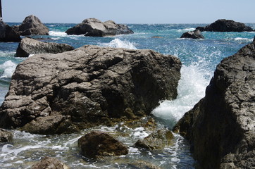 Storm of the sea on the stone beach.