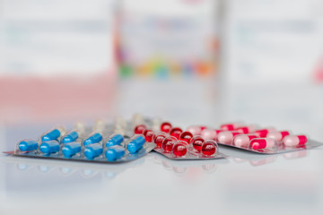 Medicine pills or capsules on white background.