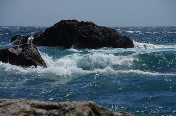 Storm of the sea on the stone beach.