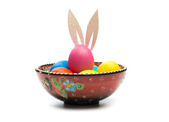 easter eggs with bunny ears in bowl isolated
