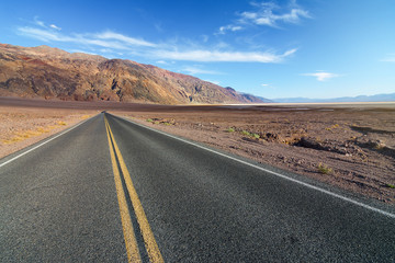 Fototapeta na wymiar American road crossing the Death Valley National Park in California, Usa