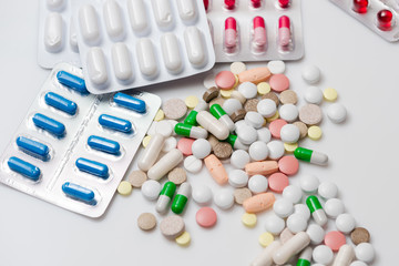 Pills and tablets as medical background. Close-up.