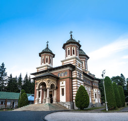 Fototapeta na wymiar Romanian traditional Christian church with blue sky in Sinaia Romania. 