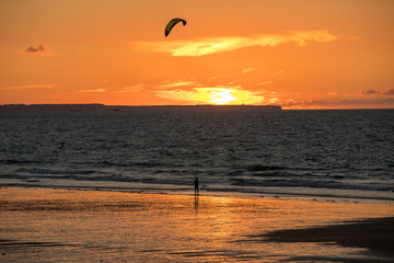 Saint-Malo, France - September 13, 2018: Sunset and Kitesurfers on the beach in Saint Malo,  Brittany, France