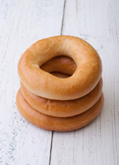 Big bagels on wooden background