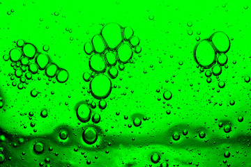 abstract background of bright green bubbles closeup