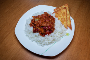 Chilli con carne with rice and nachos