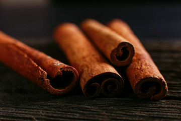 Spices sticks cinnamon on the old table. Rustic background, aroma close-up.