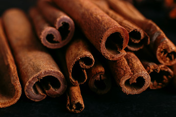 Spices sticks cinnamon on the old table. Rustic background, aroma close-up.