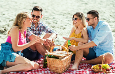 Beach picnic with friends. Lifestyle, vacation concept