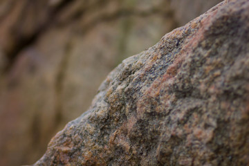 Granite rocks with blurred background. Granite close up. Texture of the stone. Natural material background