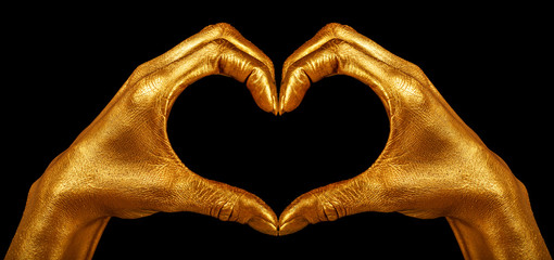 Hand gesture. Hand in gold paint, shiny, metallic. Isolated on black background.