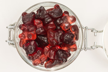 gummy candy bears with cranberry and elder fruit flavor in a glass jar