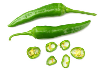 green hot chili peppers with slices isolated on white background top view