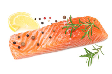Red fish. Raw salmon fillet with rosemary and lemon isolate on white background.