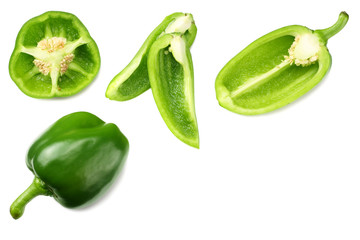 green sweet bell pepper with slices isolated on white background top view