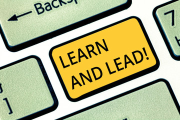 Handwriting text writing Learn And Lead. Concept meaning Improve the skills and knowledge to fit for the leadership Keyboard key Intention to create computer message pressing keypad idea