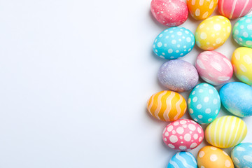 Decorative Easter eggs on white background, space for text. Top view