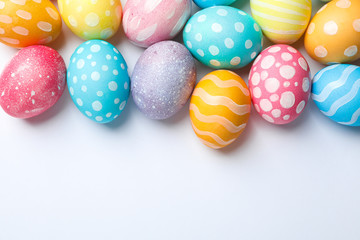 Decorative Easter eggs on white background, space for text. Top view