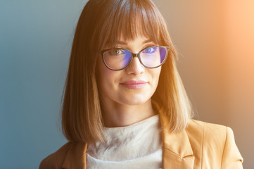 Portrait of beautiful young woman in eyeglasses