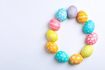 Decorative Easter eggs on white background, space for text. Top view