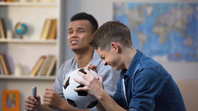 Best multiracial friends unhappy with football game score, favorite team losing