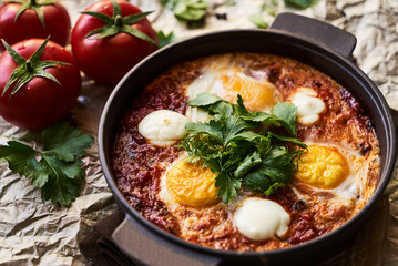 Pan of Fried Eggs with Tomatoes, Sweet Peppers and Coriander