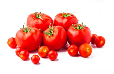 Tomatoes assorted close up front view vibrant color arrangement isolated on white background in studio