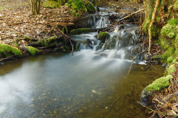 Naklejka na ściany i meble waterfall in the forest.long exposure water
